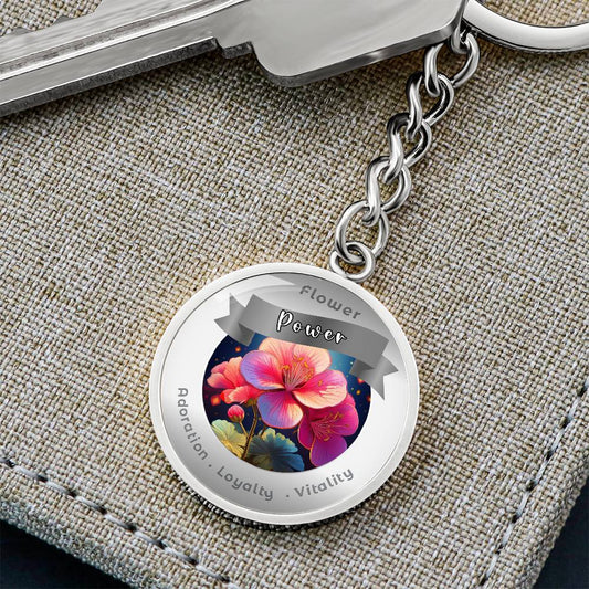 Geranium - Charm Keychain - This Luxury Charm Keychain is more than just a keyring — it’s an empowering expression of your dreams, intentions, and personal energy.Featuring an original design with meaningful affirmations, symbols, or imagery, each charm i