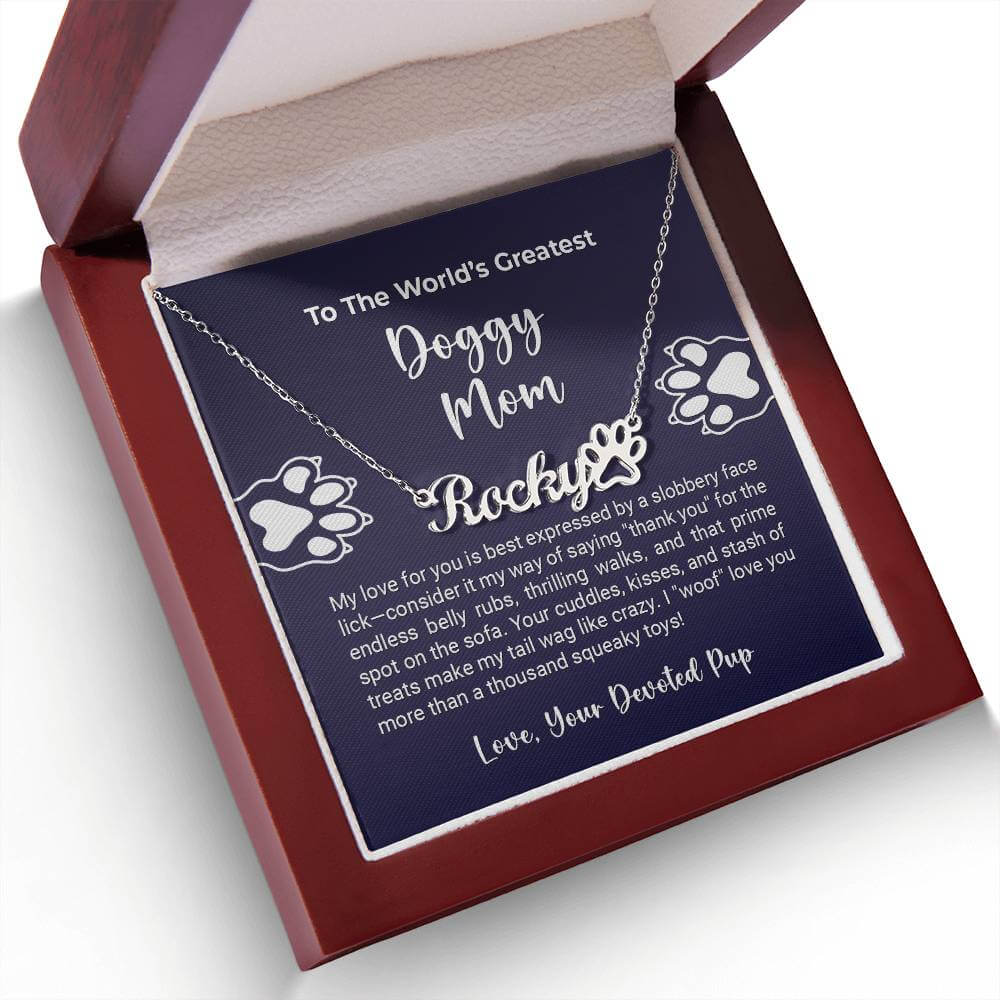 World's Greatest Doggy Mom Paw Necklace in gift box by More Than Charms, personalized with "Rocky" for pet lovers.