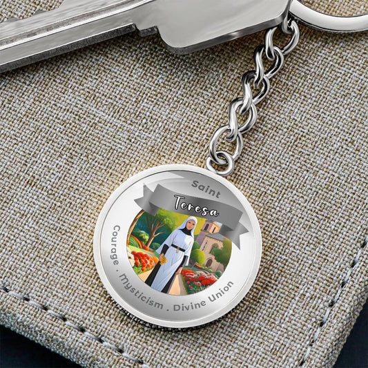 Saint Teresa - Charm Keychain - This Luxury Charm Keychain is more than just a keyring — it’s an empowering expression of your dreams, intentions, and personal energy.Featuring an original design with meaningful affirmations, symbols, or imagery, each cha