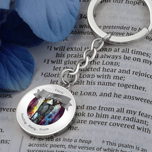 Cleric 2 - RPG Fantasy Charm Keychain - This Luxury Charm Keychain is more than just a keyring — it’s an empowering expression of your dreams, intentions, and personal energy.Featuring an original design with meaningful affirmations, symbols, or imagery,